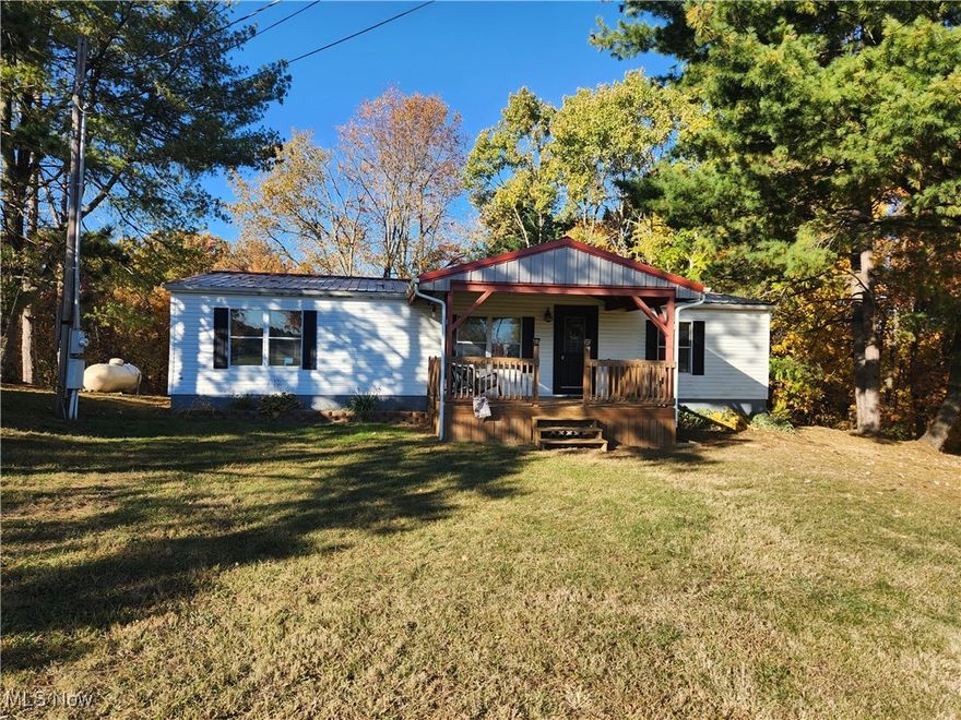 This adorable 3 bedroom, 2 bath home situated on 3.5 acres +/- is move in ready.  Featuring a new fireplace, updated flooring, large master bath and bright open kitchen.  Enjoy the covered front porch and rear deck that are perfect for entertaining.  Many updates and well maintained.