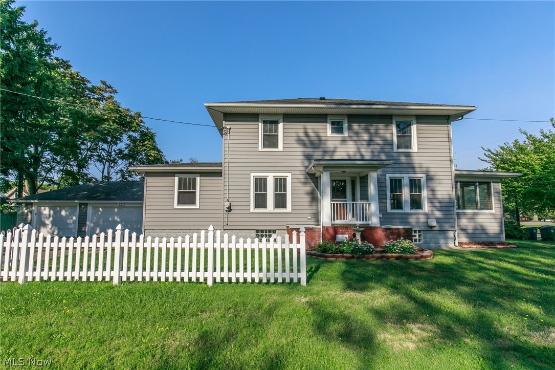 Welcome to this endearing Colonial home that is calling you to move in! This charming home has all of the vintage doors, and original hardwood floors. Step into the kitchen and check out those oak cabinets with newer stainless steel appliances, and new vinyl tile flooring! Now, walk into the living room and take a look at the enchanting built-in's next to the lovely fireplace. Can you picture those built-ins holding YOUR family pictures? Do not forget the three season enclosed porch which will be perfect for this upcoming fall weather to sit on. Stroll up the breath taking staircase to find three nice sized bedrooms. All new vinyl tile flooring and vanities in the bathrooms. Fresh paint through out, newer windows, roof, siding, AC/Furnace. Basement has been waterproofed. The three car garage is sporting new garage doors too! Take a look at this home today because it will not last long!