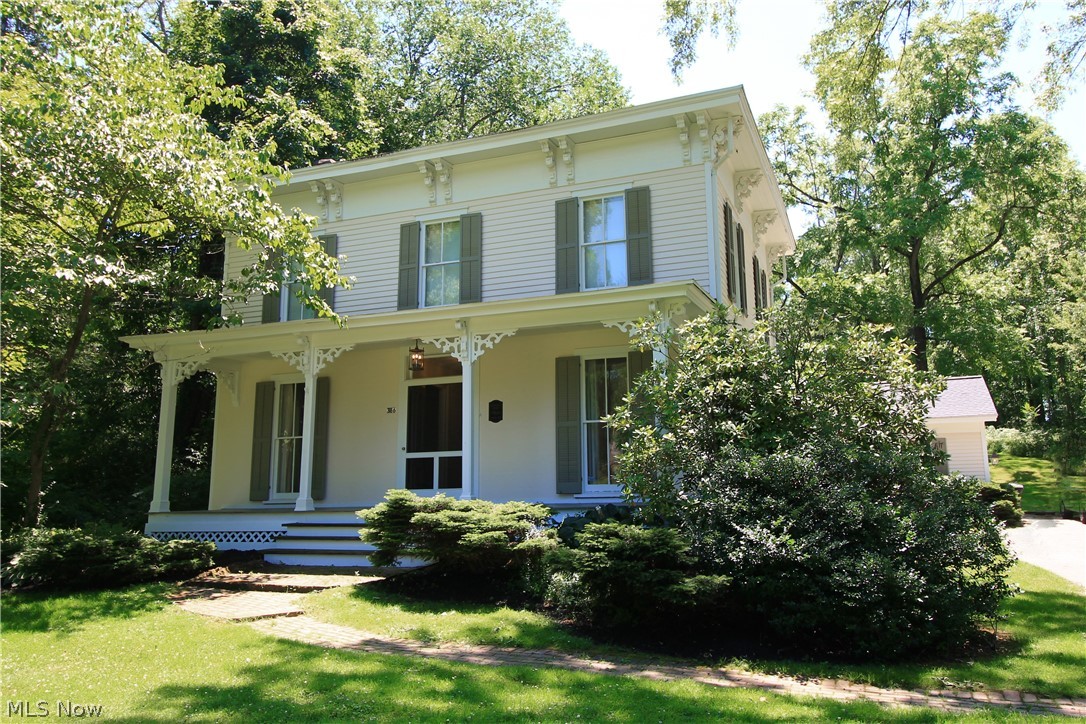 Welcome to our Century Home at 386 E Garfield Rd w/current stylish updates. This Colonial is spacious beyond belief & filled with character. Detailed moldings, solid doors & Newel posts in the Brownstone style banister flowing from the foyer to the second floor where you’ll find Owner’s suite w/full bath, an attic & lots of closet space. 3 more bedrooms & 2nd full bath complete the upstairs. Large spacious 1st floor rooms include: Frml Dining, 1/2 Bath off Fam Rm (home to the original ceiling chandelier.) Spacious Living room & newer sun-room off the back of the home too. The Kitchen features abundant French country cabinets, lots of pull out drawers, composite sink, breakfast bar & cook-top w/hood & wall oven. Luxury vinyl flooring in Kitchen, Dining Rm, Laundry & sun room, The foyer is beautiful hardwood w/Formal Living Rm, Dining, Foyer & bedrooms featuring base floor of tongue & groove pine planking. Now carpeted: Fml LR, Fam Rm & 4 bedrooms. 2 car attached garage. Sidewalks provid