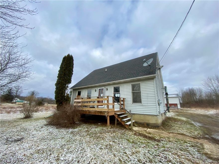 Spacious 4 bedroom, 1.5 bath Cape Cod situated on 1.7 acres with a 24x40 outbuilding. Sold as is.