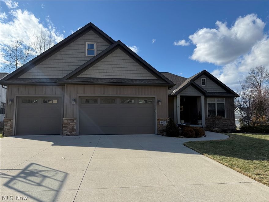 Welcome to this exceptional Kings Ridge former model home, showcasing premium finishes and thoughtful custom details throughout. The open California-style floor plan offers seamless flow and beautiful use of space, complemented by 10-foot ceilings on the main level, 9-foot ceilings in the finished walk-out lower level, transom windows for added natural light, and high-end fixtures throughout. The inviting foyer with wood flooring and custom railings leads to a stunning gourmet kitchen featuring an oversized granite island, glass-front Amish-built cabinetry, built-in desk, and stainless steel appliances. The adjacent family room with fireplace and dining area open to a private covered composite deck. The main level also includes a private office or bedroom, a well-designed laundry room with built-ins, and an additional bedroom. The primary suite offers a tray wood ceiling, spa-like bath and a custom closet. The finished walk-out lower level includes a teen or in-law suite with full bath, recreation room with fireplace, kitchen area, gaming space, and abundant storage. Sliding doors lead to a private 24x12 patio, and the backyard is fully fenced. Since 2021, the seller has added a patio with professional landscaping, hot tub with 220 outlet, gutter guards, enlarged side gate, full-yard smart irrigation system, electric vehicle charger, coated garage floor and stairs, full-yard smart lighting, and a security system with doorbell camera—making this home as functional as it is beautiful.