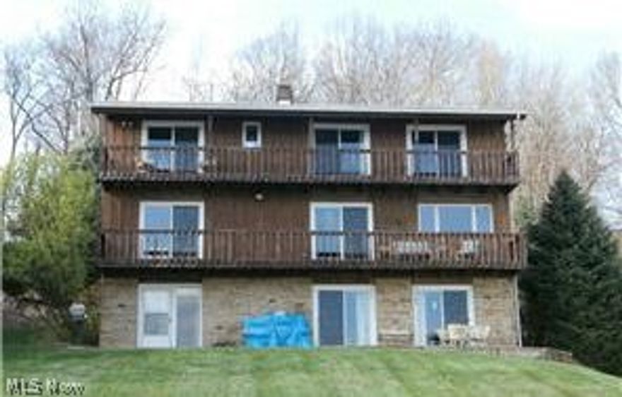 Lakefront Living at its best! From the moment you enter this house you will delight in the beautiful lake views from every room. Sliding glass doors open onto a patio deck from the kitchen, living room, rec room and every bedroom. Living room has stone fireplace with dual opening to the kitchen. True lake living! Great location! Only three houses from the golf course. The two story garage has a partially finished room below for a rec room or hobby room. Enjoy entertaining with the lake only a few steps away and fishing off your own dock. Lake Mohawk is a gated community with a 500 acre lake, unlimited horsepower, golf course, clubhouse, three beaches, tennis courts, basketball court and baseball field. New roof in 2015.