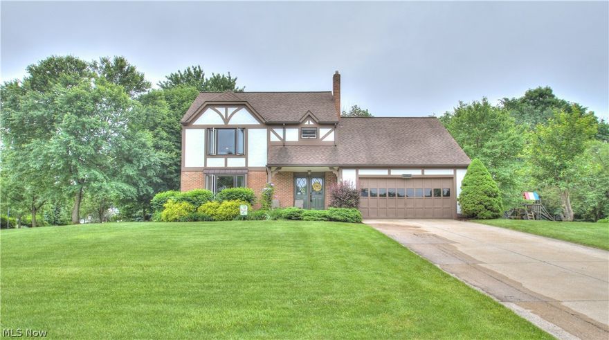 Welcome home to this lovely 4 bedroom, 2 ½ bath Tudor located in the desirable neighborhood of Summerset Estates. Situated on a spacious corner lot with tons of privacy & beautifully landscaped back yard, this well maintained home features significant upgrades inside & out. The foyer enters into an open flow floor plan. Breeze through the formal living room into the dining room, which is decorated w/beautiful wainscoting. The kitchen boasts granite countertops, custom cabinetry, stainless steel range & dishwasher, large pantry, and a center island. The family room has vaulted ceilings w/skylights, and a beautiful brick/stone fireplace which is perfect for those cozy nights in. The main floor also includes an updated half bath & laundry room. All windows were replaced in 2012 and the interior of the home was painted in 2018. Upstairs are the 4 bedrooms & 2 full updated bathrooms. The master & guest baths feature new vanities, updated tile, & new paint. The furnace & A/C were replaced in