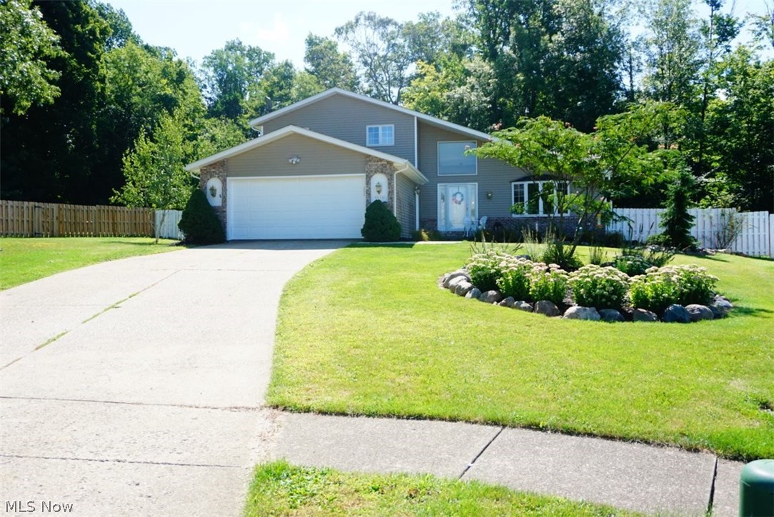 This is a well maintained home with over 2,500 sq/ft of space on a large double lot. From the vaulted ceilings of the Great Room with its wood burning fireplace to the vaulted ceilings of the huge eat-in kitchen with stainless steel appliances, hickory cabinets, kitchen island, breakfast bar and Corian countertops this home has it all. The two bathrooms are tastefully updated. The large two tier deck over looks the huge backyard that is enclosed by a wood privacy fencing. There is a shed/out building in the backyard for extra storage space. The partially finished basement is carpeted and can be a great place for an office or playroom. The exterior has maintenance free vinyl siding with updated windows. A brand new roof was installed in 2017 along with new sliding glass entry doors leading out to the patio & deck area. This is the home you will want to see.