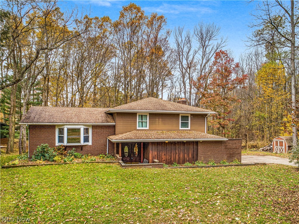 Welcome to 2324 Spring Lake Road, Uniontown~Location, Location, Location! Beautiful 1/2+lot surrounded by trees and walking trails leading to Pine Lake and the Tuscarawas River** 3-4 bedroom 2.5 bath 4 level split w/ open floor plan*Kitchen completely remodeled offers new white cabinetry, tile flooring and back splash, snack bar*Large rooms and much storage*Family room w/tile floors and wood burning fireplace with a gas starter*Sunroom with skylights leads to deck and fenced in area for pets*Great place for entertaining*Master en-suite has private entrance to its own deck overlooking beautiful lot, double closets, and full bath with new vanity*Main bath has double sinks, tile floors and nice storage closet*Second bedroom has walk in closet*Roof is 10-15 yrs*New water softener system*HWT '11*Home Warranty Provided*Call to see 2324 Spring Lake Road, Uniontown today!