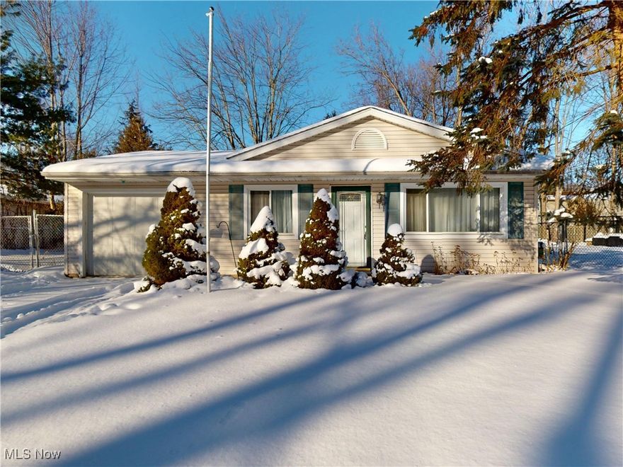 Pride of ownership speaks loudly with this gorgeous ranch situated in a very sought after area. Upon entering you will notice an open floor plan with gorgeous hardwood flooring throughout the living and dining area. The kitchen has everything you need for creating fun and exciting recipes. With white cabinetry, ample countertop space and subway backsplash. All appliances included! Take a stroll down the hallway and three spacious bedrooms and full bath await you. The best part is the back finished area. This oversized finished room with slider can easily be converted to a Fourth bedroom! Let's step outside! In the springtime this private backyard is where many family gathering and entertaining will take place. Fully fenced in with storage shed, concrete patio and a custom-built waterfall/pond. More great features include additional half bath, laundry off the kitchen, roof two years old, furnace one year old. The new owners have the option to join the Lake Erie access area. Perfect for watching the sunsets and boats go by. Such a great opportunity to make this home yours. Set up your private showing today!