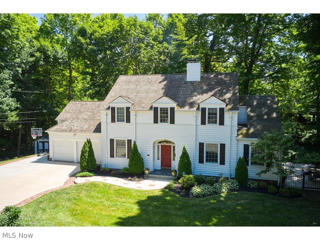 Dramatic views, coveted privacy, incredible outdoor space & walkability to Fairlawn CC & Pilgrim Square await at 251 Overwood. This one-of-a-kind 4 BR 3.5 bath Colonial situated in the sought-after Overwood neighborhood is filled w high-end updates & has undergone a full renovation in the past 10 yrs (multiple additions, plumbing, electrical, HVAC, windows). Walk up the sandstone/bluestone front walk to foyer w slate tile, stylish half bath ('20) w marble flr & honed granite-topped vanity. The open 1st flr layout is highlighted in the kitchen, part of extensive '13 renovation & feat. HW flr, custom Amish cabs, undercab lighting, Wolf 6-burner range w vented hood & 5 seater island. The dining rm ('13 addition) is surrounded on 3 sides by windows overlooking octagonal deck & park-like yard & feat. slider to deck & patios. Cozy family rm w wood burning FP w gas start. French doors lead to incredible screened sunroom addition that showcases verdant views of ivy hillside & feat. vaulted wood ceil., rec. lighting, speakers & composite decking (all added '20). Side deck has steps down to multiple levels & expansive backyard valley. Living rm/library addition w rec. lighting, HW floors & built-in shelves '20. Mudroom off of the kit w wood cabs, granite c-tops, drink fridge & lockers. Up sweeping stairs find primary suite w HW flr, lrg walk-in closet, built-ins w window bench & updated en suite full BA w lrg tile shwr w frameless glass door & granite-topped vanity '13. 2 more spacious BRs w HW flr & share full BA w tub/shower & vanity w honed marble. 2nd-floor guest/in-law suite w wood built-ins & full BA w tile flr & marble tile shwr '15. Walkout LL w gas FP, rec room w built-ins & French doors to terraced patios. Updated cedar shake roof, 2 car att. gar., extra wide concrete drive, shed & 2 large storage closets built into LL exterior, CAT5 wired, AC '23, HWT '20, furn. '17. Enjoy near total privacy while still having neighborhood feel on gorgeous Overwood Road.