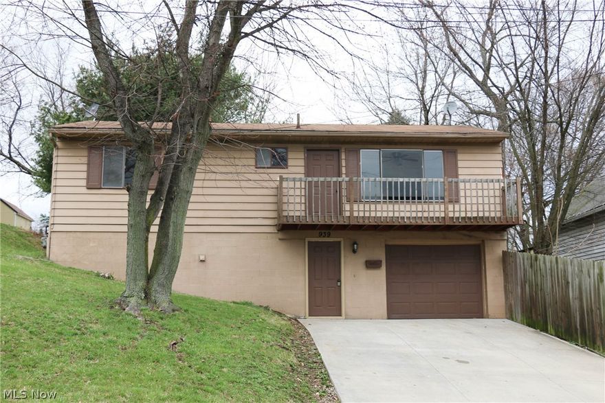 Three bedroom raised ranch features fresh paint and new carpet (2016). Partially finished walk-out lower level with office. Bedrooms with hardwood flooring. Exterior freshly painted including deck June, 2016. Front balcony and private backyard. Gravel driveway.