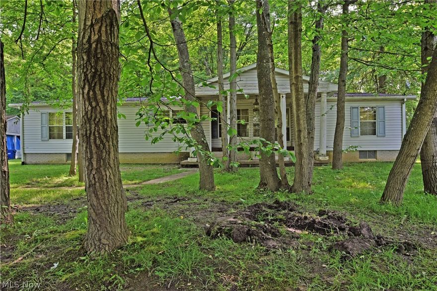 Great Price! Beautiful Setting! You are greeted at the entrance of the driveway with two brick columns one on each side then you travel through a canopy of white pines which guide you towards the house. Enjoy an evening of relaxation on your front porch or in you gazebo looking at a sunset sky and being serenaded by the bullfrogs sitting on the lily-pads that currently call the pond in the front yard home. The house sits on one of the four parcels that make up 9.705 acres. The majority of the acreage is wooded. With some TLC and loving care by new owners this 3 bedroom 2 bathroom house will become a great place to live. The over-sized 3 car garage has a large carport attached which could be utilized as a carport, side porch or a great covered picnic area. There is also a large shed that has electricity, it can be used for storing lawn equipment, work shop maybe even a playhouse or a she shed / man cave. This property is being sold "AS-IS" no repairs will be made by the seller. The sept