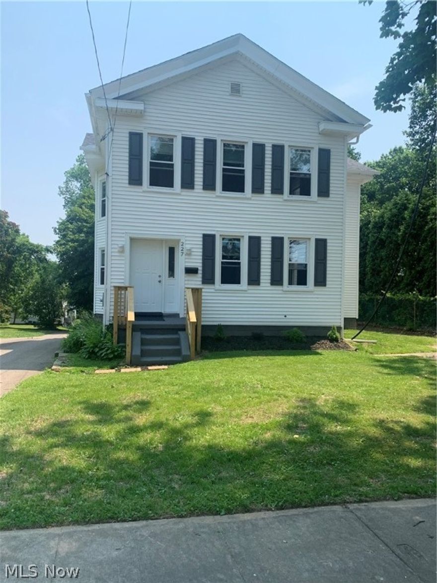 This classic Highland Square area 2200 sq ft home has been brought back to life. New items include roof, gutters, carpeting or LTV in all rooms, sump pump, 220 electrical service and panel, all light fixtures and ceiling fans, hot water tank, most windows have been replaced, and more! Luxury vinyl tile leads you from the entry way through the dining room, where an abundance of natural light shines through all of the large windows. The completely remodeled kitchen provides plenty of counter space and storage with the new center island. A convenient first floor laundry room is between the kitchen and first floor bath. Off of the kitchen is a  covered deck that will allow for outdoor entertaining rain or shine. Upstairs you'll find four large bedrooms and a beautifully updated bathroom.  2 bedrooms have additional spaces that look over the yard and could easily be used for reading rooms or home offices. The walk out basement provides plenty of space for storage as well as room for a works
