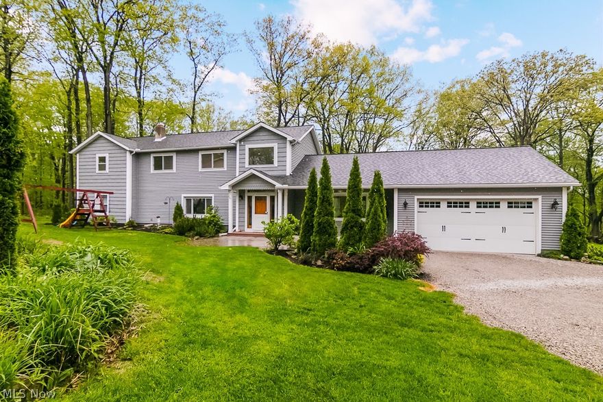 Oh My... country near the city.  Don't be fooled this top to bottom home has all the updates.  Pull down the long driveway.  Park in the attached 2 car garage or leave your vehicle outside and enter off the paved front patio/porch into a foyer that overlooks an open floor plan.  Spacious kitchen opens into the dining room.  Large great room for your entertaining and movie pleasure.  Retreat to the first floor master bedroom/master bath/full walk in closet; an oasis away from the rest of the home.  Head upstairs to a loft over looking the foyer before you step into the remaining nicely sized bedrooms and Jack n Jill bathroom.  This home boasts space for your own privacy or multiple occupants.  Let's step outside to a large yard where you back yard neighbor is the metro parks.  You have plenty of nearby hiking or horse trails.  This home has been completely remodeled/expanded between 2006-2008 including all mechanical components.  Brand new EPA approved Septic System.