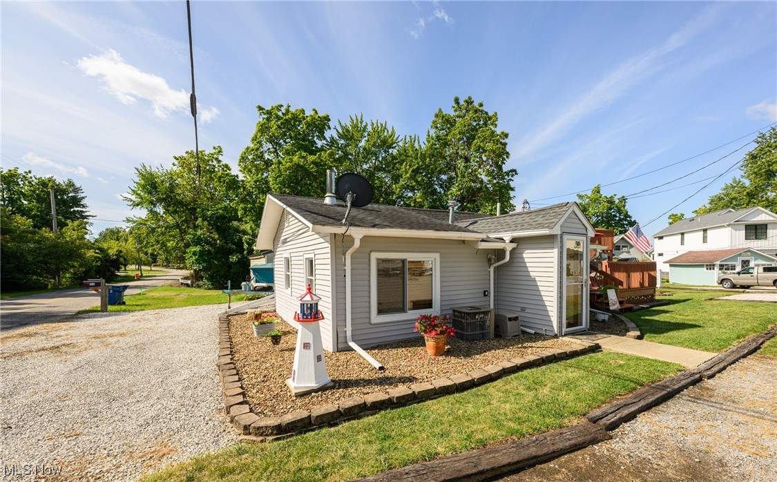 WOW! Check out this lovely water-view cottage with amazing views of Lake Milton! This home features 2 beds, a nicely updated full bath, a very large 2 -tier deck; freshly painted with even more awesome views of the lake, a spacious eat-in kitchen, conveniently located laundry, and a large family room to relax and unwind after a long day out on the lake with friends and loved ones! This home has been meticulously and lovingly maintained and is ready for its new family to create lasting memories at! This charming home is sure to be gone quick; call me TODAY for your private showing!
