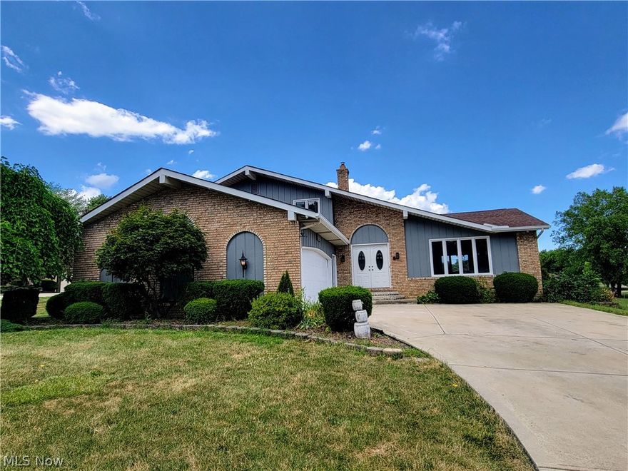 This spacious split level is tucked away on a quiet neighborhood cul-de-sac street. You'll love the big rooms and open floor plan. The elegant two story foyer presents a curved staircase and arched entry into the spacious living room. New LVT wood style flooring flows throughout the living and adjacent dining rooms. The updated eat- in kitchen offers new white Shaker style cabinetry offset with dark granite counters, and new stainless steel appliances. The LARGE family room is located just two steps down from the kitchen. This room features a new tile floor and a full brick wall fireplace. Sliding doors lead to a new concrete patio. A first floor bedroom or office and a half bath is located behind the family room. The laundry room offers lots of storage space. Upstairs you'll find three large bedroom and two updated full baths including the private master bath. The living space is extended into the finished basement with new tile floor. Check the room sizes... this is a very spacious h