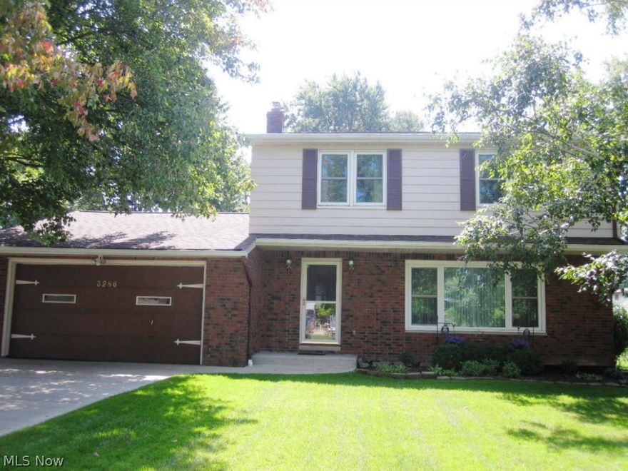 Extremely well cared for brick and aluminum colonial located in an area of newer homes. Tiled foyer leads to a formal L-shaped living room/dining room combination. Off the living room/dining room is the kitchen, which has ceramic counters and flooring, and includes all appliances. The step-down family room has a wood-burning fireplace to warm the chilly evenings. Sliders lead to a covered patio and peaceful fenced yard. The second level has a large master suite with private bath and 2 additional bedrooms with a second full bath. There are hardwood floors under all the carpet. The lower level is lined with gorgeous Nature Stone flooring. Also in the lower level is a 22x14 recreation area and adjacent utility/laundry room that includes the washer and dryer. A crawl space offers yet more storage. Updates include the roof '06; concrete drive, walkway and patio '06; back door family room slider '08; and windows, air conditioning and furnace approximately '00. Access to pathway leads to park