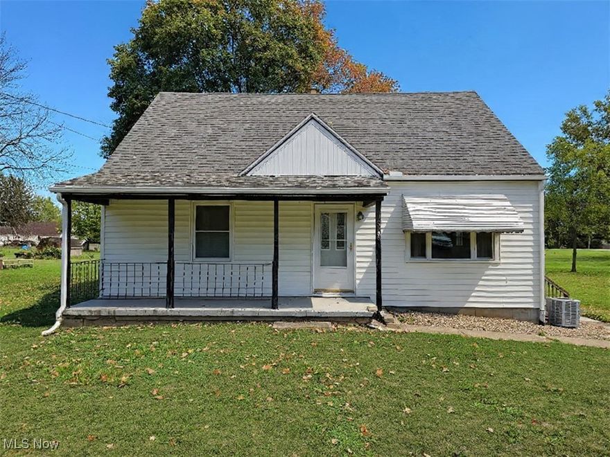 Welcome to this delightful 3-bedroom, 1-bath Cape Cod nestled in the heart of Mogadore Schools. Sitting on an impressive 1.65-acre lot, this home combines comfort, charm, and space — both inside and out! Step inside to find two spacious bedrooms on the main level, each with generous closet space, and a full bathroom conveniently located nearby. The bright and inviting living room offers a wonderful view of the neighborhood, perfect for relaxing or entertaining. The kitchen is a standout feature with ample countertop space, abundant cabinetry, and a view that overlooks the scenic backyard. Upstairs, you’ll fall in love with the cozy third bedroom, the perfect place to escape from the hustle and bustle of the day! The lower level offers a clean and versatile area for storage or hobbies, and it walks out to a backyard that’s truly a showstopper. Enjoy the serenity of your private 1.65-acre yard, complete with mature trees, open green space, and an additional garage/workshop — ideal for storing motorcycles, classic cars, lawn equipment, tools, or even turning into your dream workshop. Don’t miss this rare opportunity to own a beautiful home with room to grow, inside and out!