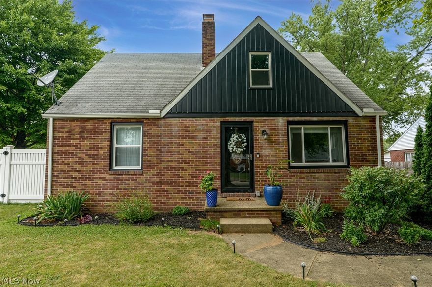 Prepare to be blown away!  This charming brick bungalow has it all!  Large lot, paved drive with plenty of parking space, 2 car attached garage, patio, deck and beautiful fenced in back yard.  Now for the inside!  Fantastic breezeway room with tile flooring, a wood burner fireplace, access to the patio and garage and it's heated and cooled.  Perfect place for some quiet time, entertaining or a play room.  Stunning is the best way to describe the kitchen!  From the lighting to the glistening granite countertops, nothing has been missed.  All stainless appliances stay too!  Kitchen opens to the formal dining area and the huge breakfast bar overlooks the living room.  Cozy living room features a gas fireplace and built in storage.  Bathroom is also completely remodeled with a crisp modern style.  There is one bedroom on the main floor and two on the second.  Upstairs there is an adorable half bath tucked in between the master and spare bedrooms.  The handsome thin planked hardwood floors