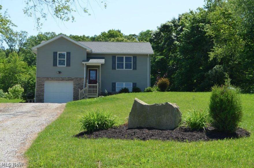 With beautiful views and room to play, this sweet county property is ready for a new owner. The home features an open floor plan, 3 BR's, 2 full Baths, living room and family room. Updates include new flooring, C/A, paint, and landscaping. Over-sized garage has room for two small cars or workshop area.  ***Location is approximately 1.5 miles east of Nashville.