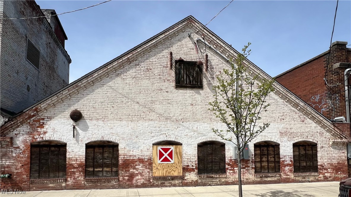 Welcome to a canvas of opportunity in the Mill District of vibrant downtown Kent, where historic charm meets modern potential! This unique 3500 square foot building, currently utilized as a warehouse, offers boundless possibilities for transformation.
Imagine stepping into a space that whispers tales of its past while providing a blank slate for your future. This structure boasts 18 ft ceilings and has been recently updated with a new roof and an efficient electrical panel in 2024, and the addition of a concrete ramp for loading and docking, this property is more than ready to begin its next chapter.
For the creatively inclined, the site beams with potential. The current owner had a vision of a bespoke brewery, with preliminary designs already drafted, inviting a savvy investor to bring this vision to light. Or perhaps envision a chic loft conversion, a bustling restaurant, or an art gallery that captures the essence of the locale—whatever your dream, this space is your gateway.
Let’s talk location! Situated in the heart of a district renowned for its arts and culture, this property promises significant pedestrian footfall and visibility.
With Kent State University nearby, the area is bustling with youthful energy, potentially benefiting businesses that cater to a younger demographic.
This property doesn’t just come with four walls and a roof but promises a location that brims with life and a multitude of stories just waiting to be written. Are you ready to make your mark in Kent?