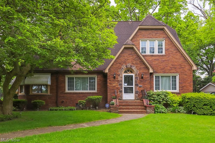 Welcome to 1352 Delia Avenue! This stately brick colonial was previously referred to as a mini-mansion and sits on two beautiful lots. This property boasts four bedrooms (with a first floor bedroom and bath), three full baths, and a two car attached garage. Beautiful woodwork and crown moulding in the living and dining rooms add to this home's character while the entrance between the two is framed with beautiful french doors. Entertain guests in the finished basement complete with its own kitchen, living and dining areas, a full bath, a possible fifth bedroom and it's own library. There are also beautiful hardwood floors underneath the carpet, newer windows and recessed lighting in the basement and kitchen areas. The roof and the tankless water heater are both less than ten years old and the sump pump was installed in 2016. Please contact the listing agent today to schedule your private showing!