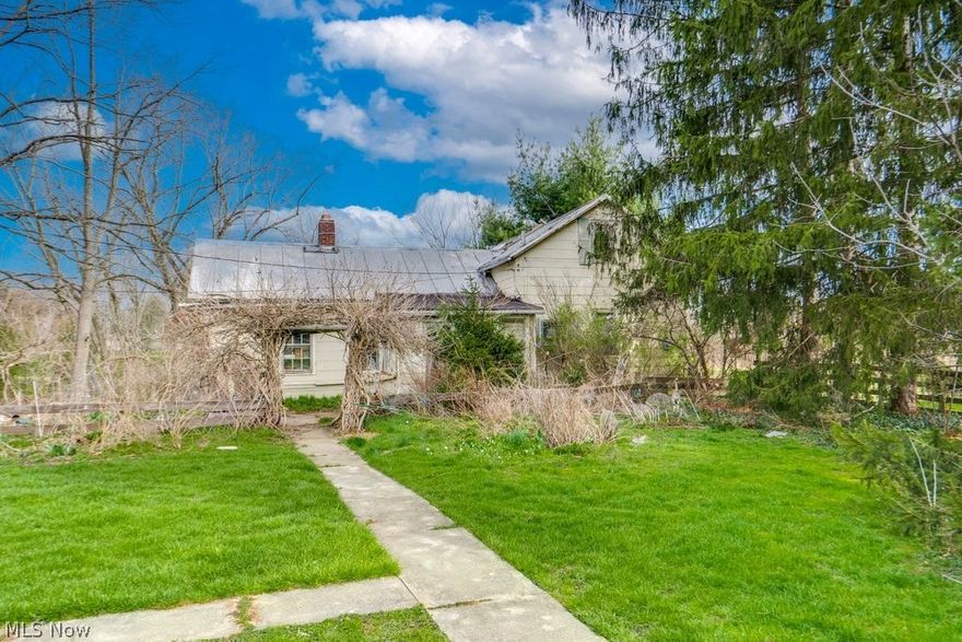 Seize this rare opportunity to own nearly 10 private, rural acres in the heart of Valley City in Liverpool Township, and Buckeye Local School District. This 9.46-acre picturesque property is the ultimate blank canvas, boasting a mix of wooded terrain and open land, highlighted by a charming winding creek. Whether you are seeking a prime investment, a site for a custom-built estate, a project to revive the historic 1886 horse/livestock barns, or a private retreat for camping & outdoor adventures, this property offers limitless potential! Structures are being Sold STRICTLY AS-IS. This is a magnificent piece of land in a prime location. All structures, including the existing century cottage & large barns, reflect a historic past but are considered a total tear-down or a major "down-to-the-studs" renovation project. This is a magnificent piece of land in a prime location. Sold in AS-IS condition with all faults. SHOWN BY APPOINTMENT ONLY— PLEASE DO NOT TRESPASS.