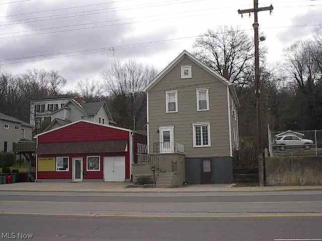 Commercial Building formally used as a Carpet store with a 2 story 3 bedroom home. Property goes all the way back to Pleasant Ave. Located in High traffic area.