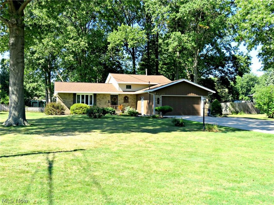 Meticulously Maintained 2200 sq.ft Split Level situated on a stunning park-like property. The newer roof(2011), gutters(2001), partial brick facade, vinyl siding(2000), front door(2005) & freshly painted garage exterior(2015) boasts attractive curb appeal. Inside, the main level provides a lovely sun lit living room w/ bay window & spacious eat-in kitchen w/ newer solid wood cabinets, tile floor & sink(all new in 2011); plus an extended counter/bar top, dining area & included appliances. A few steps down leads you to a cozy family room, full bath & utility room. Upstairs you will discover 3 sizable bedrooms w/ hardwood floors & 2nd full bathroom.  The heated garage offers hot & cold water, drain, workbench, storage cabinets, garage opener & convenient man door. The backyard is truly amazing, with a covered concrete patio w/ gas grill, lush landscaped beds, mature trees & large storage shed. Conveniently located near shopping & quick highway access.  Amherst Schools. Call today for a pr