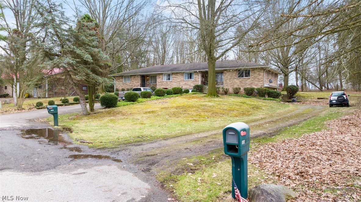 7 Rental Properties, 16 Total Units - (4) Duplexes, 26+ Acres, Large Shop Building, Portage Co., Suffield Twp., Field Local Schools - (2) 4-Unit Apartment Buildings, Stark Co., Lake Twp., Lake Local Schools - Multi-Par Auction, Buy One or All! Live Auction with Online Bidding on Real Estate. ABSOLUTE AUCTION, all sells to the highest bidders on location. Auction to be held at 1836 Hudacsek Dr., Mogadore, OH 44260. ONLINE BIDDING BEGINS TUESDAY, APRIL 16, 2024 – 12:00 PM and AUCTION LIVE ON-SITE BIDDING WILL BEGINFRIDAY, APRIL 19, 2024, 11:00 AM, REAL ESTATE SELLS AT 12:00 PM. AUCTION #1: 1838 & 1836 Hudacsek Dr., Mogadore, OH 44260 includes parcels 36-012-00-00-013-000 & 36-012-00-00-014-000. Brick and stone ranch duplex situated on 22.17 acres with 5,900 SF shop building. Nice, wooded parcel with loads of wildlife. Built in 1977 with approx. 2,952 SF. One well & septic and separate electric and gas meters. One side currently rented at $800 per month. Main level has kitchen with dining area, two bedrooms and full bath. Lower level has two-car garage, half bath, modern gas furnace, recreational room, and laundry room. The other side is much larger and was previously owner occupied. Main level has living room, kitchen with dining area, enclosed back porch, family room with fireplace, two bedrooms, full bath, master bedroom with private master bath and formal dining room. Lower level has a two-car garage, living room, storage areas and possible fourth bedroom. Ideal owner-occupied unit next to shop building.
Shop Building: Approx. 5,900 SF shop building with stone/metal siding, 12’ interior ceilings, several overhead doors and 3-phase electric. Interior features several bay areas divided by steel roll up doors. Bay #1 is approx. 40’x52’ with gas furnace, half bath, overhead door, and front office area. Bay #2 is approx. 40’x40’ with overhead door. Bay #3 is 34’x40’ with overhead door and a rear enclosed 14’x44’ lean-to with overhead door.