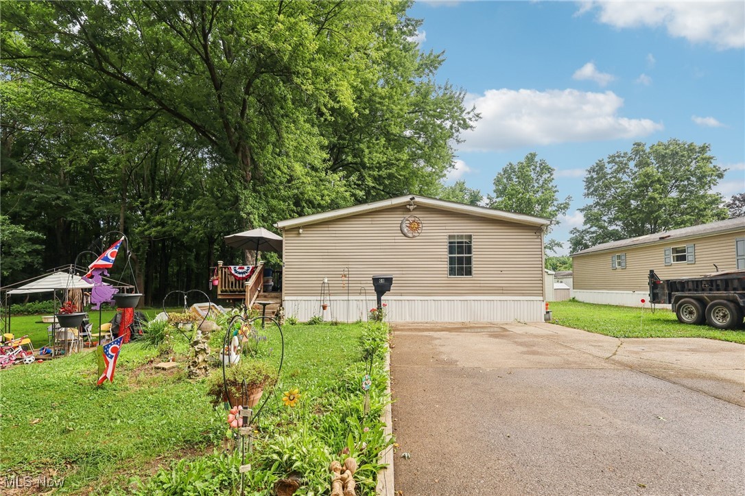 Welcome home to this charming 3-bedroom, 2-bathroom mobile home nestled at the end of a quiet, dead-end street. Enjoy peace and privacy with no through traffic and a serene natural setting. This well-maintained home features a newer roof, a spacious front porch perfect for morning coffee, and a wide driveway offering plenty of parking. Inside, you'll find a comfortable layout with generous living space, making it an ideal place to call home. Don’t miss this opportunity for affordable living in a peaceful location! Schedule a showing today!