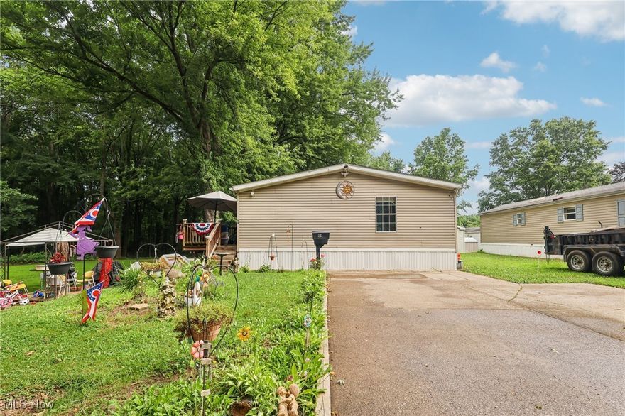 Welcome home to this charming 3-bedroom, 2-bathroom mobile home nestled at the end of a quiet, dead-end street. Enjoy peace and privacy with no through traffic and a serene natural setting. This well-maintained home features a newer roof, a spacious front porch perfect for morning coffee, and a wide driveway offering plenty of parking. Inside, you'll find a comfortable layout with generous living space, making it an ideal place to call home. Don’t miss this opportunity for affordable living in a peaceful location!  Schedule a showing today!