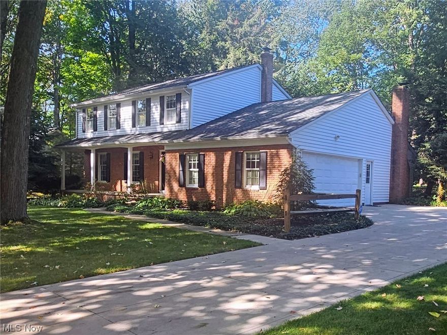 Classic Colonial in the heart of Mentor awaits you.  This 4 bdrm 2.5 Colonial was built by Ruple Builders and sits on nearly a 1/2 acre offering a private wooded lot.  Features include a spacious Living room, Family room with brick fireplace, Dining room, and eat-in kitchen with all appliances.  All 4 bedrooms up with 2 full baths up which include a full bath off of the main bedroom.  Full basement with rec room and laundry/storage room.  The backyard is wooded and offers privacy and a back patio.  Relax on the covered front porch and enjoy the seasons.  Newer roof and driveway.  The driveway is oversized and offers plenty of room for multiple cars and or camper/boat. Also, Security System and Ring door bell. A true classic colonial with solid bones waiting for your personal touches.