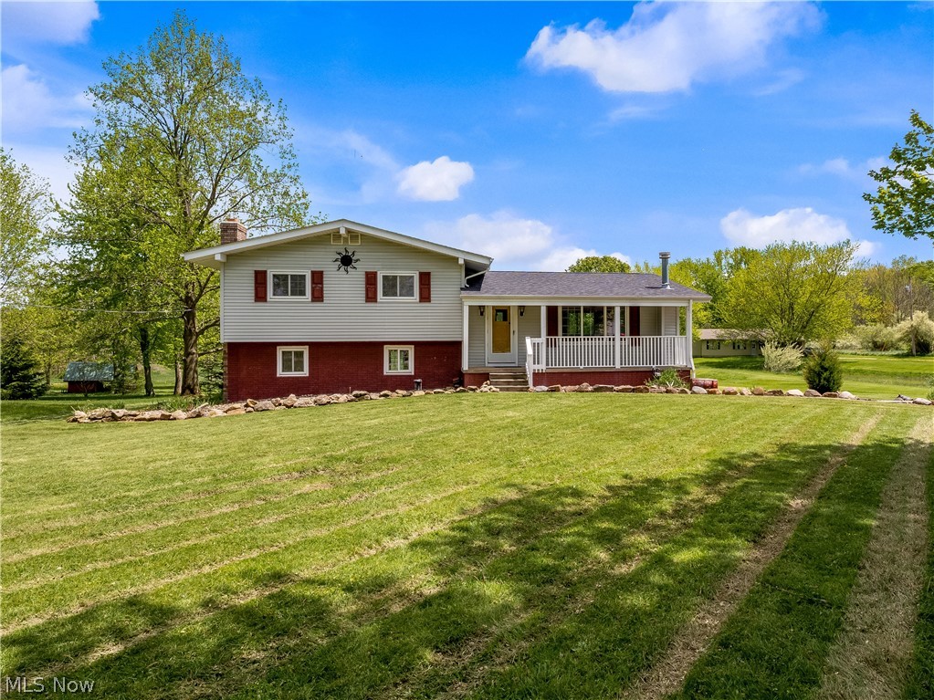 Looking to put some space in between you and your neighbor that's not too far outside of city limits? Look no further! Welcome home to this 3 bedroom, 3 bath split level located on 3 acres of land in Lafayette Twp. You can enjoy the outdoors on your front porch or back patio and there's also a barn in the backyard with a couple stalls that can be used for horses, other livestock or additional storage. Inside on the first living level is an expansive great room with a wood-burning fireplace and access to a full bath and laundry room. The main level is where you'll find the kitchen featuring oak cabinets, newer vinyl flooring, stainless steel appliances and a pantry. A nice breakfast bar separates the kitchen and the dining room and it flows into the spacious, front living room. Upstairs is where the 3 bedrooms are located with access to a remodeled full bath in the hall. Private access to a half bath off the primary bedroom. New roof as of 2019. Schedule your showing today to see why yo