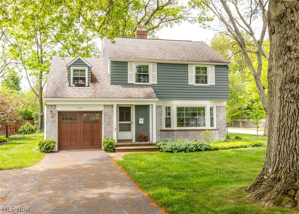 Picture perfect Colonial with great curb appeal on prime Beachwood street! Current owner has upgraded interior and exterior finishes, updated kitchen and windows, and meticulously maintained this home. Spacious living room with fireplace greets you with big picture window offering views of the passing seasons. Formal dining room with many built-ins is in "L" shape with living room for ease of entertaining. Updated kitchen has ample storage, newer backsplash, newer flooring and appliances, and plenty of inspiration for the home chef! Delightful enclosed porch off kitchen is perfect for summer evenings looking at the groomed and landscaped backyard which includes a variety of flowering trees. Convenient powder room is off the kitchen as well. Upstairs oversized master suite has a wall of built-ins and ample closet space. Two additional bedrooms also with plenty of storage. Don't miss the balcony off the bedroom/office - great reading or sunning spot! Full bath in hall has shower over tub. Basement Rec Room could be play space or media room. Unfinished area has laundry and newer mechanicals. One car attached garage. Corner lot. Hot Water Tank 2020. Windows replaced in 2018. Exterior painted 2022. Award winning Beachwood schools! Also available for rent.