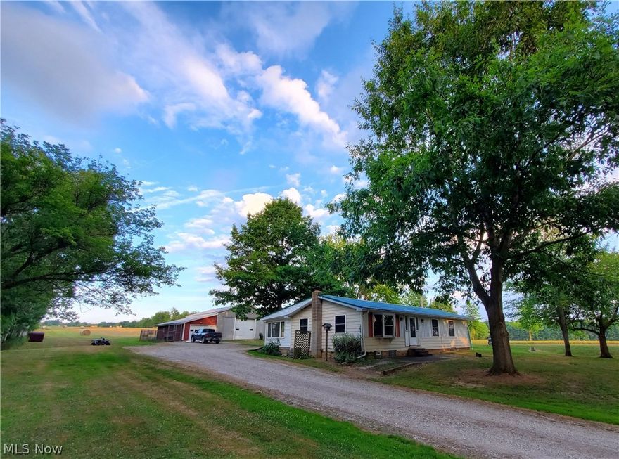 Beautiful setting on a great piece of land. 3BR/1.5BA Ranch on quiet country road with 5.13 acres, stocked pond, and a nice 47'X40' outbuilding with electric loft and overhead garage doors/ Additional 7'X17' lean-to on South side of barn and 8'X40" dog kennel on North side of barn. Solid functional home but could use some renovations/updating. Home has newer metal roof and some Pella replacement windows. 15'X15' covered deck off back of home. All appliances are included.