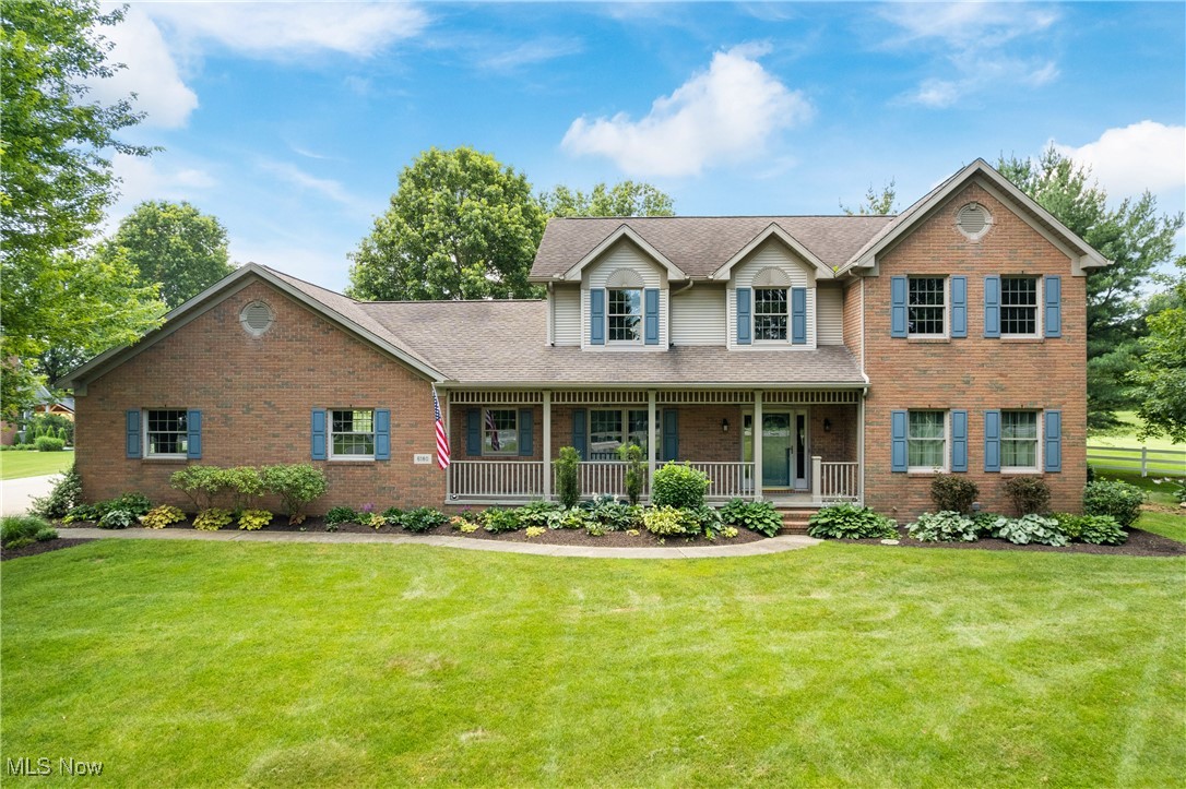Welcome to 6180 Edison St in Hartville, Ohio - a beautifully built, solid brick two-story home nestled on 1.43 picturesque acres with breathtaking golf course views that can be enjoyed from your private deck or patio. This meticulously maintained, one-owner property offers a rare combination of privacy, space, and comfort. So many local treasures within a short drive from this home include: Maize Valley Winery directly across the street with live music in the summer, 1875 Winery, Lost Trail Winery, Hartville Hardware, Hartville Flea-market, Quail Hollow Trails, Congress Lake Country Club, and the beautifully maintained Sable Creek Golf Course - which is located right in your back yard for endless outdoor recreation. Step inside to find recently refinished hardwood floors, a spacious and light-filled first floor with a formal dining room, a large eat-in kitchen with sliding doors leading to the backyard, and multiple living areas perfect for entertaining or relaxing. The thoughtfully designed layout includes four generous bedrooms upstairs, including a luxurious master suite featuring a jetted tub, walk-in closets, and a spacious private bath. The finished basement expands your living space with a second kitchen area, additional bedroom, full bath, and it's own entrance from the heated 4-car attached garage, making the basement area ideal for guests, multi-generational living, or even rental potential. An additional detached garage/shed offers even more storage or hobby space. Energy-efficient, geothermal heating, high-quality construction, and a truly unbeatable setting make this home stand out. Located in Marlington School District, and also just a short drive from Lake Schools, this home offers the best of both worlds: serene country living with easy access to nearby conveniences. Don't miss this rare opportunity to own a home with unmatched views, high-quality features, and endless versatility. Schedule your private tour today!