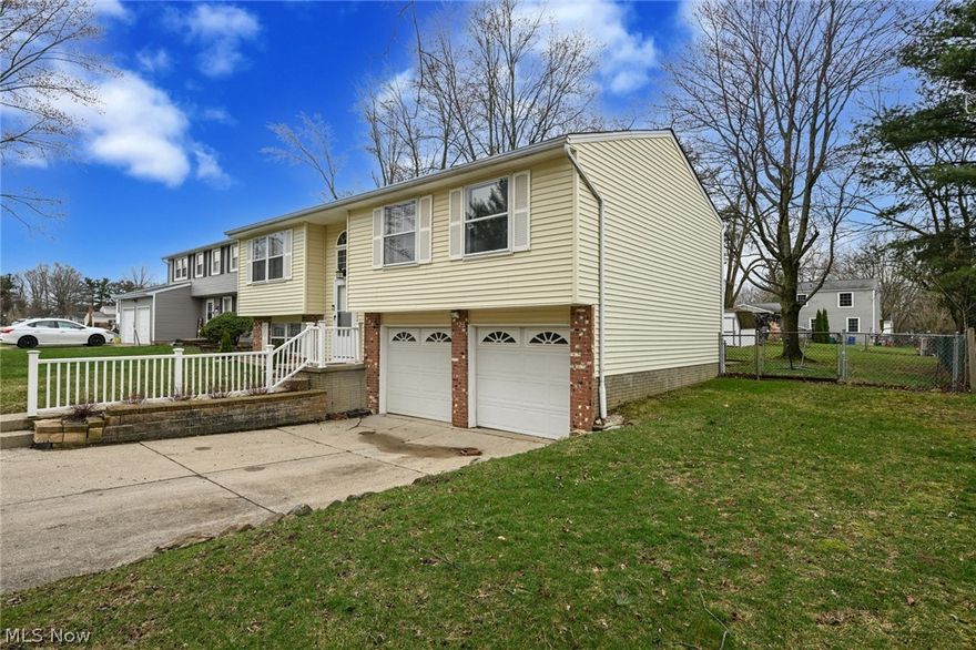 Welcome to 925 Gayer Dr., Medina, OH! A charming 3-bedroom, 2-full-bath home ready for new owners. Bright, spacious living areas set the scene for holiday gatherings, while the fully appointed kitchen includes a built-in buffet with storage. The rear bonus room addition (ceiling radiant heat, separate thermostat) opens to the deck and works perfectly as a family room, home office, den or playroom. Two generously sized bedrooms share a full bath, with a smaller third bedroom also on the main level. The lower level offers a versatile bonus room with a closet, ideal as a fourth bedroom, exercise room, rec room, or gaming space, plus a second full bath and a separate laundry room with washer and dryer. An attached 2-car garage keeps you dry and provides extra storage.
Outside, a fully fenced yard with a separate dog run, paver patio and fire pit creates a great entertaining and pet friendly space. The neighborhood features sidewalks for evening strolls and friendly neighbors. The home is forced-air heated (new AC installed 2023); only the rear bonus room uses radiant ceiling heat. While it may benefit from some TLC, this property is a wonderful canvas to make your own. Schedule a tour and imagine the possibilities at 925 Gayer Dr.