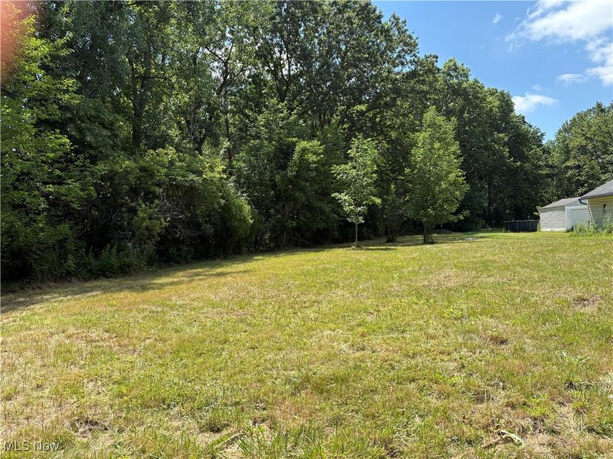 Lovely buildable lot includes a new sewer tap ($10,000 value) and boasts both sides of a scenic 10-foot wide water stream.  Build your dream home on this large .54 acre lot overlooking this beautiful running stream.