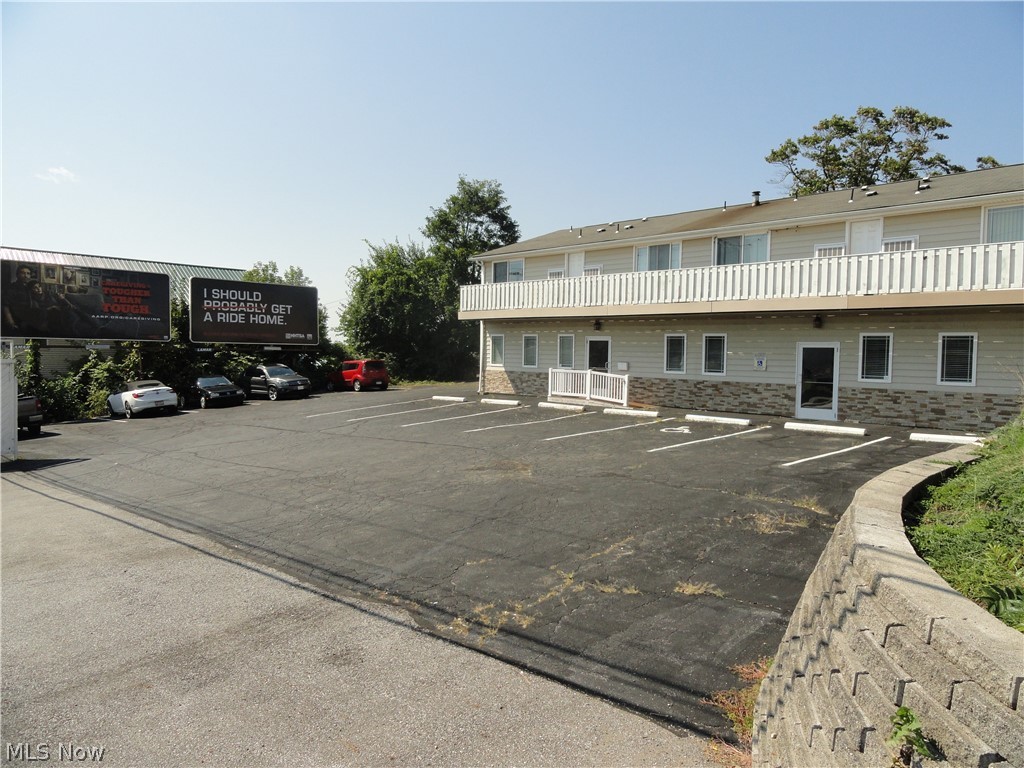 Building includes 4 one bedroom apartments with some appliances, hardwood floors and washer/dryer hookups. Approx 1100 sq ft office or retail space, off street parking for 10-15 cars.