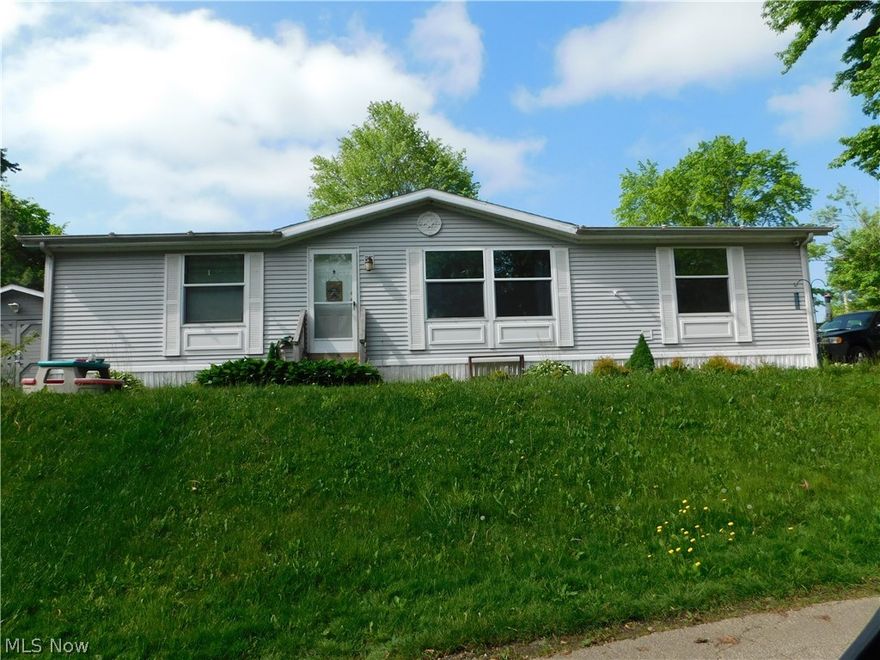 Welcome home to this updated 3 bedroom 2 bath home! The open kitchen has beautiful backsplash and a walk in pantry big enough for a chest freezer that stays with the home. The dining room leads you into the huge living room with lots of natural light. The master bath has a spacious walk in shower measuring 50 x 50. The bedroom closets offer plenty of storage space as well. There is a shed behind the home for extra storage and a nice patio and gravel area to BBQ and hang out. Many flowers planted around the home, last year the seller even had a garden going. There is a grape abhor behind the shed growing good as well.  Located in Summit estates off summit road. Conveniently located near KSU and expressways