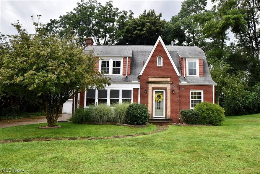 Stunning 4 bedroom brick tudor in Plain LSD. This home is located on a charming brick street and is loaded with tons of character and beautiful natural woodwork. The spacious living room has a cozy wood burning fireplace and built in cabinets. Adjacent is a sunroom with beautiful french doors. Formal dining room. The kitchen is newly remodeled with espresso 42 inch cabinets, granite countertops, glass tile backsplash, stainless steel Samsung appliances and a large farmhouse sink. The first floor has low maintenance LVT flooring. Upstairs you'll find a master bedroom with two single closets plus 3 more bedrooms and a updated bathroom. This home also has a full unfinished basement with laundry area, full shower and toilet area and tons of storage. Outside you'll enjoy a very private backyard and 2 car garage. New furnace 2020. Updated electric 2018. Central Air 2008. Windows 2011. Home warranty is being offered by the seller.  Hurry for your chance at this wonderful home!