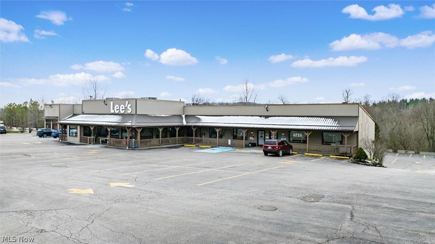 A rare opportunity to own one of the area’s most notable historic landmarks—currently operating as a long-time, well-known restaurant. This 17,000 sq. ft. property sits on four lots totaling nearly 3 acres, offering exceptional versatility, visibility, and income potential. Some property features are two fully equipped commercial kitchens with professional-grade equipment, multiple walk-in coolers and freezers, freight lift connecting floors for efficient service and operations, three banquet facilities ideal for private dining, weddings, or corporate events, separate entrances, utilities, and loading doors—allowing for multi-purpose or independent business use, 7 separate restrooms throughout the building and ample parking to accommodate large events or multiple tenants, high-traffic, high-visibility location with easy interstate access. This property offers countless possibilities—continue as a well-established restaurant or repurpose as an Amish-style bakery and deli, a renowned steakhouse with bar, event or banquet center, medical/physician office, retail complex, or recreational venue. Additional income offered with a rental space generating $2,900 per month on a month-to-month lease, providing immediate supplemental revenue. A unique combination of historic character, modern infrastructure, and strategic location, this property is perfectly suited for an investor or owner-operator ready to create new value while preserving a local treasure.