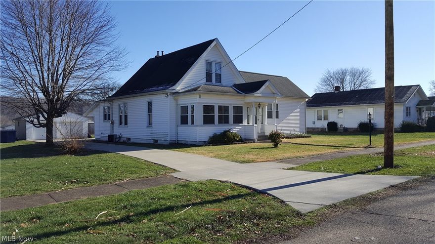 Very well maintained 2 story home.  Master bedroom with walk in closet & bath with walk in shower on main floor.  Washer & dryer hook up on main floor. Newer kitchen, windows, roof.  Front porch enclosed with newer windows and screen in back porch.  Oak pocket doors between dinning & living room.  Great condition wood work. Dinning room features built in hutch and napkin cabinet.  Ceiling fans in most rooms.