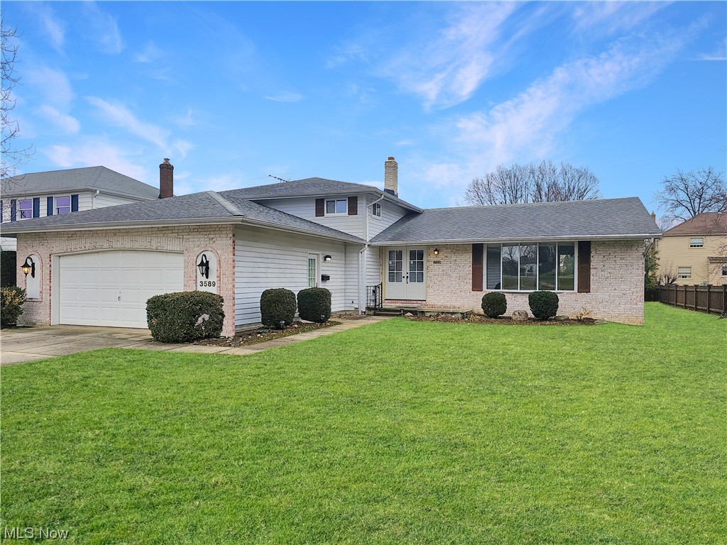 This RENOVATED split-level home is located in one of Rocky River's coveted neighborhoods, just across from Tri-City Park. The freshly painted interior has been completely renovated with new LVT flooring throughout the main living areas; the upstairs bedrooms have new carpeting. You'll love the new kitchen, and updated bathrooms. The first floor boasts an open layout with vaulted ceilings in the dining room and living room. The lower level features a spacious family room with a brick fireplace, an office/bedroom, laundry room, and half bath. Upstairs, find a primary suite with private bath, two bedrooms, and another full bath. The basement offers a finished recreation room and storage space. Enjoy a sizable backyard and attached two-car garage. Conveniently close to shopping, restaurants, and highways. Photos have been virtually staged; home is unfurnished. New windows are ordered to replace the older metal sliding windows. Don't miss!