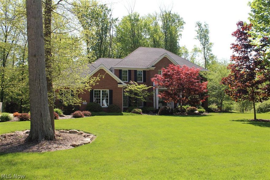 Fantastic all brick home built by Tom Moock...This home sits on an acre park like setting. Enter into the home and you are greeted by a beautiful 2 story foyer. There is a formal living room, D.R. & an incredible kitchen that overlooks the family room. Off the kitchen is a peaceful sunroom that overlooks the fantastic private yard. The finished lower level is a perfect in-law suite or great place for teenage kids! There is a kitchenette, rec-room, game room area, full bath and a wine cellar. This home is custom in every way...No detail overlooked.