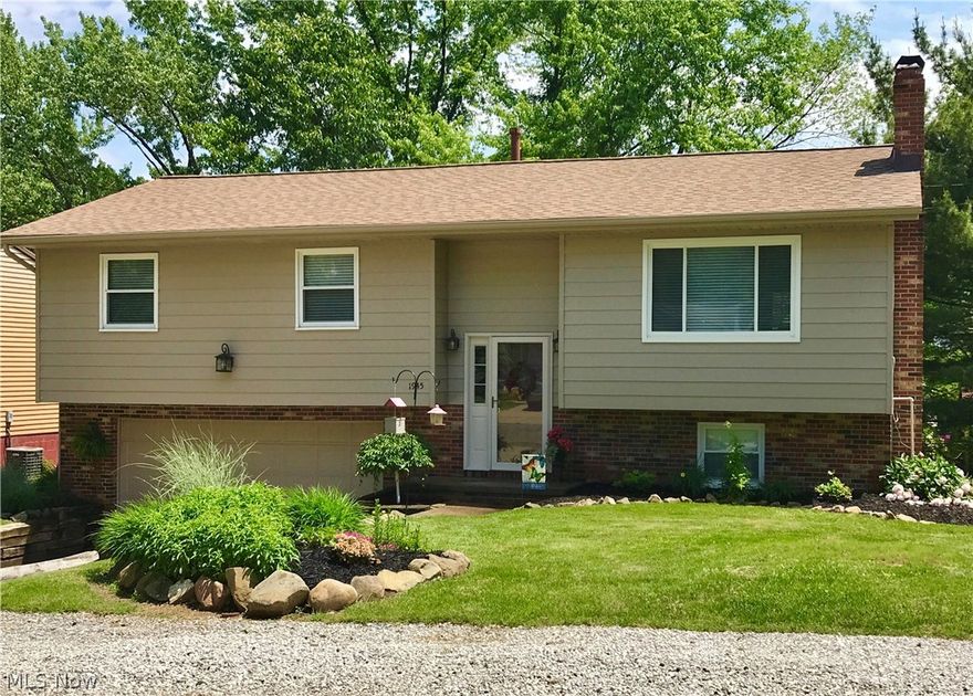 Inviting 3 bedroom, 2 bath bi-level located near bike trail and 80 acre Kelsey Park. Updates include: bathroom with double vanity granite, roof, high efficiency furnace, A/C, humidifier, flooring, countertops, patio doors, windows, blinds, interior and exterior paint. Fully applianced kitchen offers, desk area and breakfast nook. Rec room offers walk in closet with rough plumbing for wet bar, access to full bath and concrete patio overlooking babbling creek at rear of property. Agent owned.