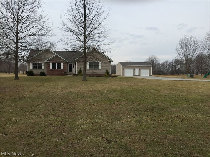 Are you looking for just enough acreage to play but not too much to maintain? Welcome to this impressive ranch nestled on a picturesque home-site in North Jackson. Gracious living surrounded by mature trees, this brick and vinyl home is situated in Jackson Milton Schools. Enjoy this one owner 2005 built home with 1st floor living that boasts vaulted ceilings, over-sized great room with fireplace and an open kitchen equipped with stainless appliances. This home entertains 3 bedrooms with potential for 5 with the finished lower level adding additional space and comfort. The spacious master suite includes a Jacuzzi garden tub with separate shower and double sink. Cozy up to the fireplace or entertain on the 2 tiered deck with a hot tub and swimming pool. In addition to the 2 car attached garage, bring your toys because the 2 year new 24x32 additional detached garage awaits you with plenty of room for cars, toys and a workshop. Welcome to your piece of heaven.