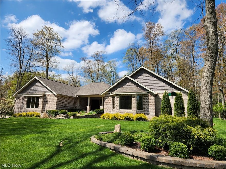 Quality and style beyond compare in this luxurious custom built open concept brick and stone ranch home. This is a one of a kind property that offers top of the line features from the wood look tiled floors, crown moldings, and quartz countertops to the Hunter Douglas power window treatments thru out. All cabinetry and built ins done by Custom Design. Enter the home into a 13x8 spacious tiled Foyer with elevator entry to the garage and basement. Spectacular kitchen offers a double columned spice and baking storage area, expandable lighted center island, raised dishwasher, French door built oven, gas stove with commercial vent fan and much more. The 24x17 Master Suite with double trayed ceiling, includes a custom built in dresser, built in coffee bar, spacious walk in closet with built ins, dressing room and no step shower. There is a large functional 1st floor Laundry with built in in cabinets. The Morning Room and Great Room both offer a view of the 18x16 covered porch and private and