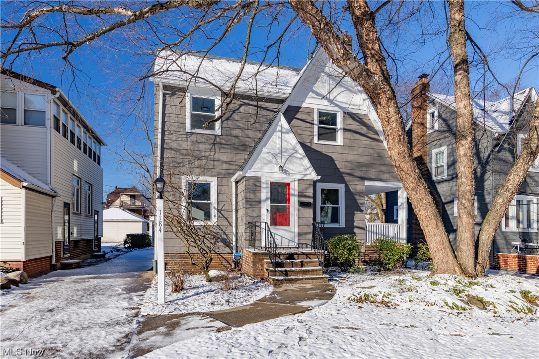 Welcome to this charming and updated colonial on a tree-lined street. Every room had a makeover! The inviting entry with a convenient coat closet and windowed door opens to the neutral freshly painted living room with a wood-burning fireplace, lovely sconce lights, and new luxury vinyl flooring, that runs throughout the main living rooms. There is a door that leads to the casual side porch and an arched doorway connects to the formal dining room with charming corner cabinetry, ideal for displaying family treasures. The focal point of the home is found in the well-equipped kitchen! Everything is new, top to bottom, cabinetry & hardware, quartz counters and tile backsplash, LVT flooring, and stainless appliances. So convenient, there is a brand new powder room here as well! The sleeping quarters are found on the second floor. Three bedrooms with new carpeting and fresh paint that share the hall bath with subway tile surrounding the entire tub wall! The third-floor bonus room is the perfect space for a child's playroom, home office, or fourth bedroom. There is electric baseboard heating in this room. The lower level is divided into two sides, one with the potential to be a recreation room, exercise room, media room or playroom. The second side has the laundry hook-ups and newer mechanicals. Additional improvements include all new windows, new HVAC, new roof and gutters, new lighting throughout, and a two-car detached garage. With nothing left to do but move right in, the next buyer will enjoy this home.
