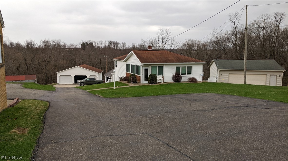 Well maintained 3 bedroom ranch on over 3 acres. This home is move-in ready and needs nothing. Newer flooring and oak trim through out. Includes 2 detached garages. The newer garage is a 2 plus car and the original is a 1 car garage. Both have electric and garage door openers. Asphalt drive and parking area. Located close to the new schools and downtown but has a country feel. The back of the lot is wooded and private. Only a short drive to several public lakes and thousands of acres of public hunting.