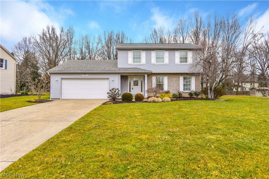 ABSOLUTLEY GEORGOUS HOME! Located in the heart of Canfield this 3 Bedroom, 2 & 1/2 Bathroom Home will take your breath away. this LOVELY Features Include:  Incredibly Large Front Living Room, Large Dining Room that is perfect for Sunday family dinners and for the Holidays, Amazing Back Family Room with a gas fireplace that will warm you up on cold winter Ohio nights. Updated Custom Kitchen with Stunning Hardwood Floors & Breakfast Area, and Large half Bathroom. The Second Floor offers FANTASTIC Hardwood floors throughout (under carpet), a Large Master Bedroom with Master Bath, 2 more large Bedrooms & 2nd Full Bath.  Lower Level offers a Large Rec Room Area & Laundry Room Area.  There is also a Large Sun Room with a Beautiful Stone Concrete Patio which leads to a Private, Professionally Landscaped Back Yard that opens up to a park like setting.  Updates Include:  Updated Kitchen & Bathroom, Updated AC Components - 2014, New Gutters - 2013, New Pella Windows, New Hunter Douglas Blinds, N