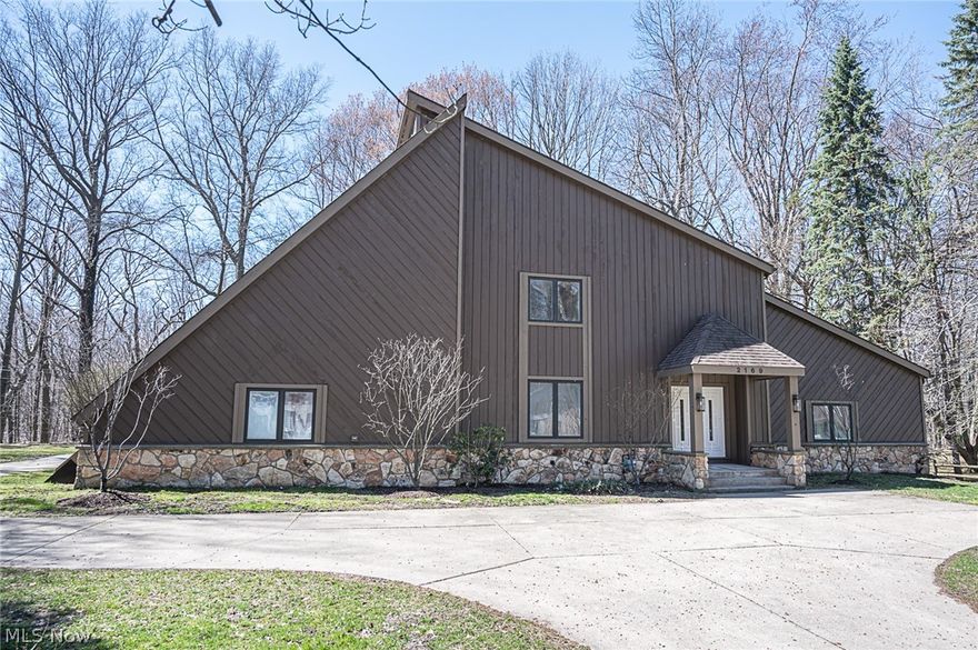 Awesome 3,576 SF 5 bedroom contemporary colonial on nearly 2 acre parklike setting in sought after Lake Erie Beach Community. Resort/Lodge type feeling with an incredible 36' indoor swimming pool W/Balconies, cedar lined walls, soaring Ceilings & skylights allowing for lots of natural light. Sunken family room with stone walled fireplace. Huge Gourmet E/I Kit Loaded with custom built in cabinetry, granite countertops & new SS appliances including nice hood fan over the large center island. Fantastic home office with 2 large rooms and access to garage for seperate entrance. Bonus rm upstairs w/ skylights & wetbar. The entire home has been remodeled with Fresh paint, all new flooring, fixtures, doors & remodeled bathrooms. Home is situated back on wooded ravined setting with walking paths. Private beach just a few steps away. Free Water, Sewer, Cable + Trash * A must see Wow!